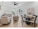 Open concept living room with dining area, neutral tones, and stylish furnishings at 925 E Chelsea St, Tampa, FL 33603
