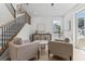 Inviting living room with staircase, modern furniture, stylish accents, and natural light at 925 E Chelsea St, Tampa, FL 33603