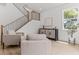 Bright living room featuring modern furniture, stylish cabinet and staircase at 925 E Chelsea St, Tampa, FL 33603