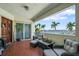 Enjoy stunning waterfront views from this cozy balcony with comfortable seating and a peaceful ambiance at 1003 Bellasol Way # 9203, Apollo Beach, FL 33572