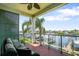 Inviting outdoor seating area overlooks canal with beautiful waterfront view and access to boat docks at 1003 Bellasol Way # 9203, Apollo Beach, FL 33572