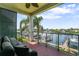 Relax on the balcony with comfortable seating and enjoy the serene waterfront views at 1003 Bellasol Way # 9203, Apollo Beach, FL 33572
