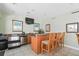 Convenient bar area with appliances and seating, great for entertaining at 1003 Bellasol Way # 9203, Apollo Beach, FL 33572