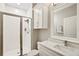 Bright bathroom with a glass-enclosed shower and modern white vanity at 1003 Bellasol Way # 9203, Apollo Beach, FL 33572