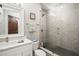 Modern bathroom features a walk-in shower with gray subway tile and a marble vanity at 1003 Bellasol Way # 9203, Apollo Beach, FL 33572