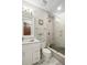Modern bathroom features a walk-in shower with gray subway tile and a marble vanity at 1003 Bellasol Way # 9203, Apollo Beach, FL 33572