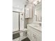 Clean bathroom features a glass enclosed shower, updated vanity, and marble tile floors at 1003 Bellasol Way # 9203, Apollo Beach, FL 33572