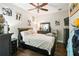 Cozy bedroom with dark wood furniture and personal touches at 1003 Bellasol Way # 9203, Apollo Beach, FL 33572