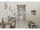 Bright, modern hallway with marble floors, stylish decor, and convenient storage at 1003 Bellasol Way # 9203, Apollo Beach, FL 33572
