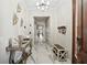 Elegant hallway featuring marble floors, modern decor, and a decorative chandelier at 1003 Bellasol Way # 9203, Apollo Beach, FL 33572
