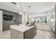 Bright kitchen features an island with seating and grey accents at 1003 Bellasol Way # 9203, Apollo Beach, FL 33572