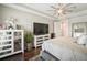 Comfortable bedroom with tray ceilings, large windows, and stylish decor at 1003 Bellasol Way # 9203, Apollo Beach, FL 33572