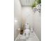 Stylish powder room with modern fixtures, marble floors, and decorative accents creates a chic ambiance at 1003 Bellasol Way # 9203, Apollo Beach, FL 33572
