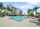 Luxury building and pool area with ample lounging and recreation space at 1003 Bellasol Way # 9203, Apollo Beach, FL 33572