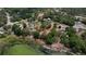 Gorgeous aerial view of cleared homesite nestled among mature trees and bordering the lake at 10030 Lake Dr, Weeki Wachee, FL 34613