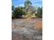 Cleared lot ready for construction with mature trees and views of the adjacent lake at 10030 Lake Dr, Weeki Wachee, FL 34613