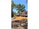 The exterior features blue vinyl siding with white trimmed windows at 10030 Lake Dr, Weeki Wachee, FL 34613