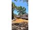 View of single Gathering home with blue siding and white framed windows at 10030 Lake Dr, Weeki Wachee, FL 34613