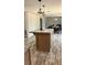 Kitchen island featuring stylish marble countertops with seating for casual dining at 10030 Lake Dr, Weeki Wachee, FL 34613