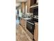 Kitchen featuring stainless steel appliances and bright cabinets at 10030 Lake Dr, Weeki Wachee, FL 34613