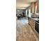 Kitchen featuring stainless steel appliances, bright cabinets, and ample countertop space at 10030 Lake Dr, Weeki Wachee, FL 34613