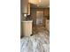Well-lit kitchen with wood cabinets, granite countertops, and an open layout at 10030 Lake Dr, Weeki Wachee, FL 34613