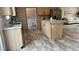 Open kitchen layout with modern island, stainless appliances, and seamless living area access at 10030 Lake Dr, Weeki Wachee, FL 34613