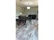 Open concept living space with dining area, modern lighting, and contemporary furnishings at 10030 Lake Dr, Weeki Wachee, FL 34613