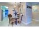 Charming dining area featuring a modern chandelier, decor, and view into the kitchen at 10037 62Nd N Ter # 9, St Petersburg, FL 33708
