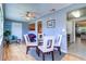 Bright dining area with neutral blue walls, wood floors, and views into other rooms at 10037 62Nd N Ter # 9, St Petersburg, FL 33708