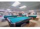 Large game room with multiple billiard tables, tables and chairs at 10037 62Nd N Ter # 9, St Petersburg, FL 33708