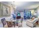 Open floor plan with a dining area and living room, featuring neutral walls and tile flooring at 10037 62Nd N Ter # 9, St Petersburg, FL 33708