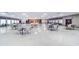 Spacious recreation hall featuring tables, chairs, and ample space for gatherings at 10037 62Nd N Ter # 9, St Petersburg, FL 33708