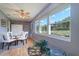 Sun-drenched sunroom with large windows, allowing natural light and views of outdoors at 10037 62Nd N Ter # 9, St Petersburg, FL 33708