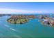 Panoramic aerial shot of a waterfront community with a golf course and stunning waterways at 10355 Paradise Blvd # 412, Treasure Island, FL 33706