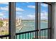 Scenic water view from a balcony, showing docks, boats, and waterfront properties on a sunny day at 10355 Paradise Blvd # 412, Treasure Island, FL 33706