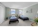 Bedroom featuring twin beds, natural light, and neutral walls with a large closet with louvered doors at 10355 Paradise Blvd # 412, Treasure Island, FL 33706