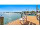 Scenic view of a dock with a white bench overlooking the water and boats at 10355 Paradise Blvd # 412, Treasure Island, FL 33706
