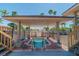 Covered hot tub area with a view, featuring steps, a safety railing and clear spa rules at 10355 Paradise Blvd # 412, Treasure Island, FL 33706