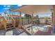 Outdoor hot tub with seating under a covered area, stairs and handrails for access at 10355 Paradise Blvd # 412, Treasure Island, FL 33706