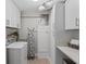 Functional laundry room with ample storage, modern appliances, and practical layout at 10355 Paradise Blvd # 412, Treasure Island, FL 33706