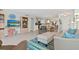 Inviting living room with stylish furnishings and seamless flow to the kitchen and dining area at 10355 Paradise Blvd # 412, Treasure Island, FL 33706