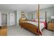 Spacious main bedroom with a double door closet, light-colored walls, wood furniture, and an ensuite bathroom at 10355 Paradise Blvd # 412, Treasure Island, FL 33706