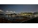 Scenic waterfront view at night showing boats docked along the water at 10355 Paradise Blvd # 412, Treasure Island, FL 33706