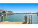 Beautiful waterfront view from the dock, with boats and buildings visible in the distance at 10355 Paradise Blvd # 412, Treasure Island, FL 33706