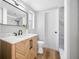 Updated bathroom with stylish vanity, sleek black fixtures, and modern mirror at 10825 Oakdale Ave, Port Richey, FL 34668