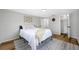 Serene bedroom with patterned rug, ample natural light, and a calming color scheme for a peaceful retreat at 10825 Oakdale Ave, Port Richey, FL 34668