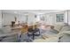 Spacious living room featuring hardwood floors, and stylish furniture next to the dining area at 10825 Oakdale Ave, Port Richey, FL 34668
