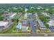 A lovely aerial shot highlighting the community pool and surrounding buildings near the lake at 1100 E Bay Dr # 60, Largo, FL 33770