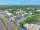 An aerial view of a neighborhood with beautiful green spaces and nearby commercial services at 1100 E Bay Dr # 60, Largo, FL 33770